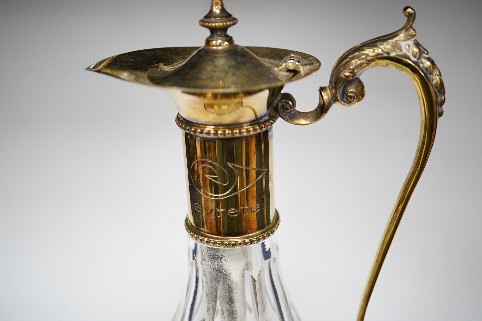 A modern silver gilt mounted cut glass pyriform claret jug, maker JM, Sheffield, 2001, 31.2cm. Condition - good